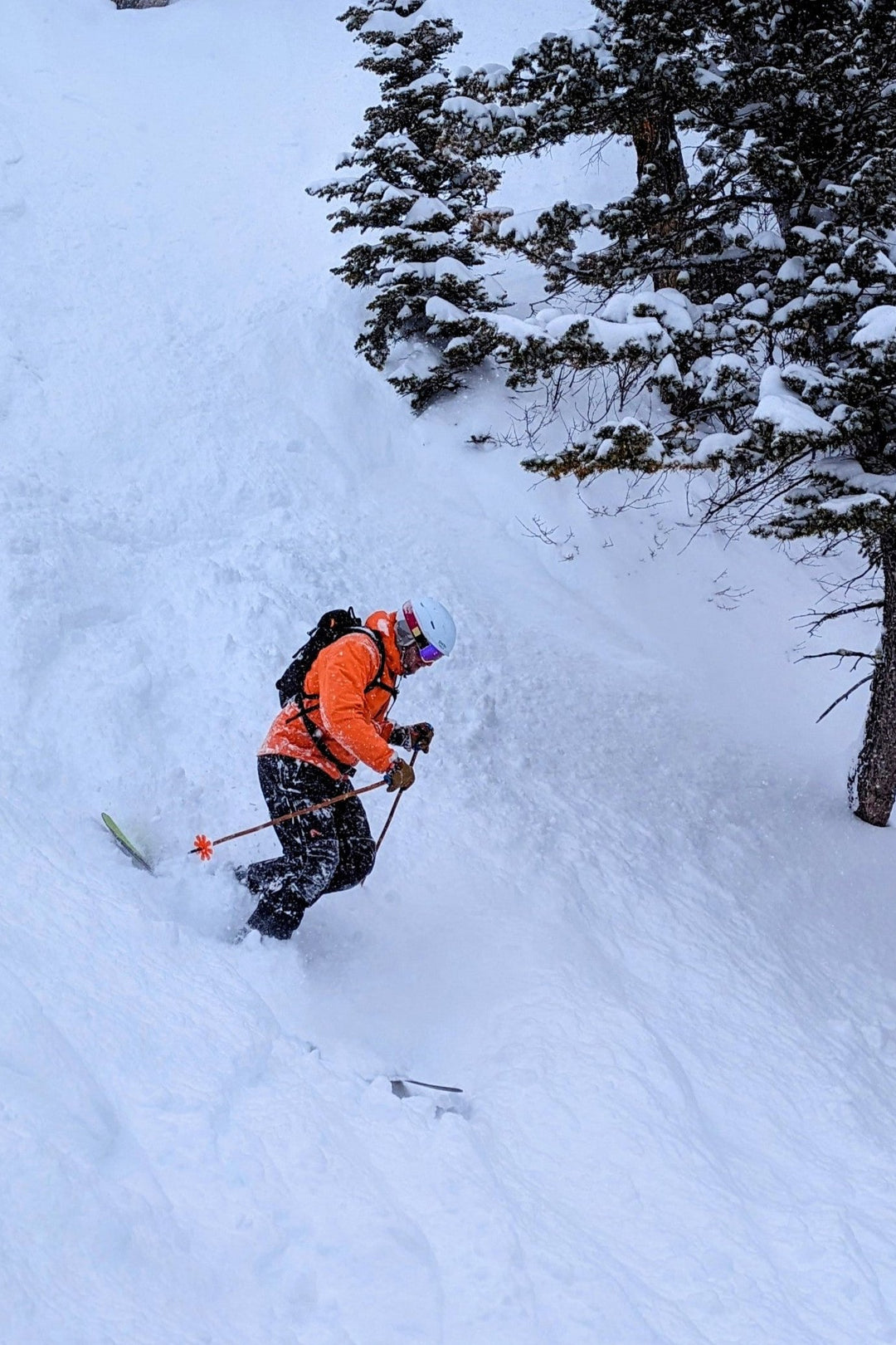 Skier enjoying powder at Bridger Bowl using Mtn Straps ski pole straps